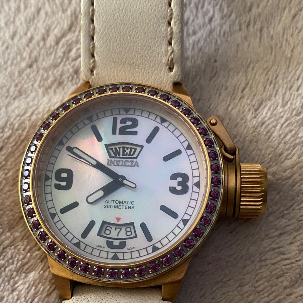 Invicta Gold Smartwatch with White Strap and Purple Details motion movement